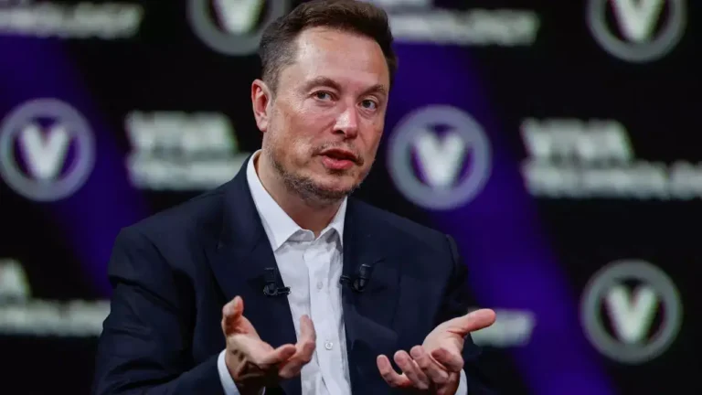 Elon Musk speaking at a conference amid financial turmoil